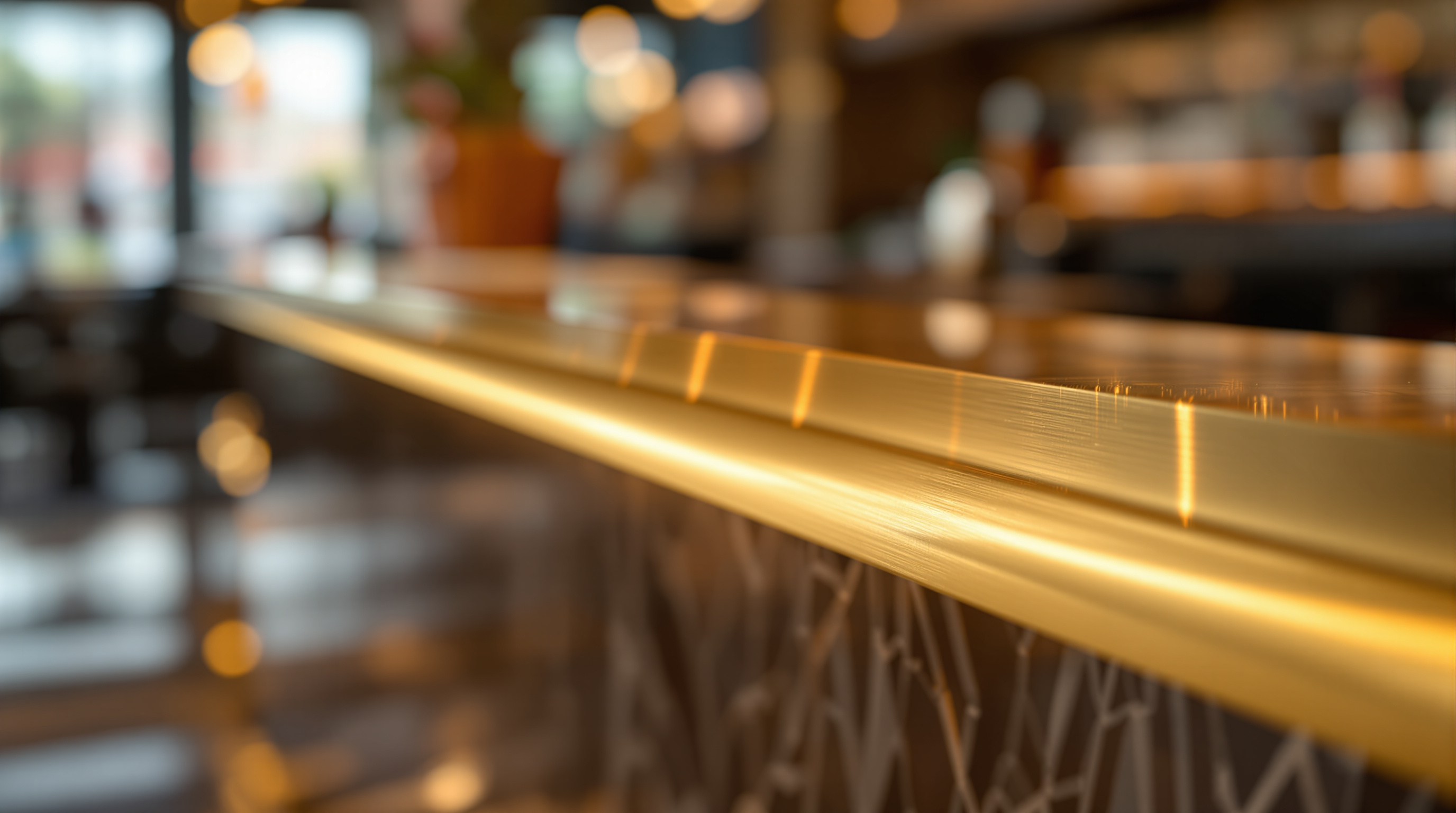 Gleaming polished brass bar nosing detail on luxury bar counter